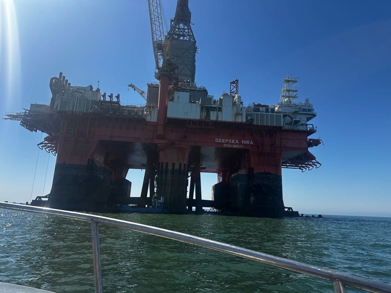 Deepsea Mira photographed from the water, with its name visible on the hull